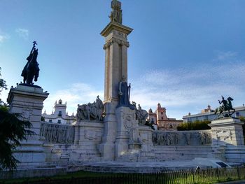 Low angle view of statue against blue sky