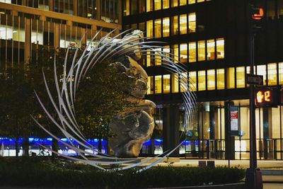 Illuminated buildings in city at night