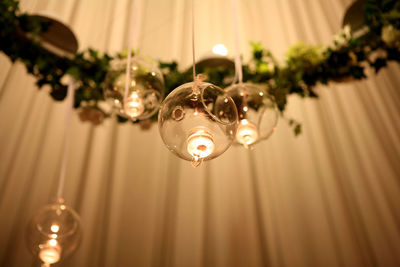 Close-up of illuminated lamp hanging at home