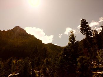 Scenic view of mountains against cloudy sky