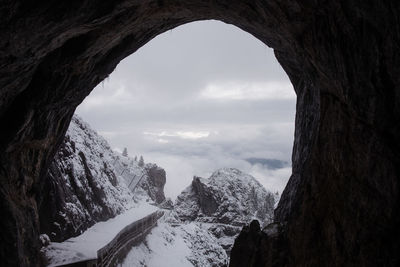 Scenic view of snowcapped mountains from inside of eiswelten cave in werfen