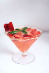 Close-up of drink in glass over white background