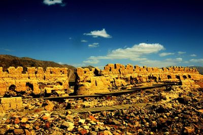 Scenic view of landscape against blue sky