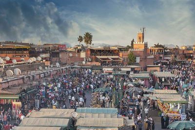 High angle view of people in city against sky