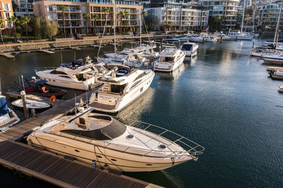 High angle view of boats moored at harbor