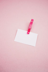 High angle view of blank adhesive note on white background