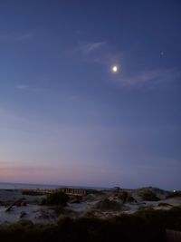 Scenic view of landscape against sky at night