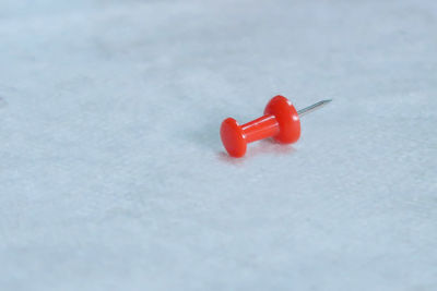High angle view of red snow over white background