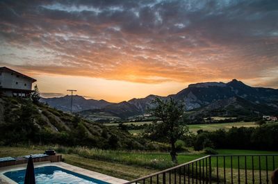 Scenic view of mountains against cloudy sky