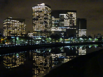 Illuminated buildings in city at night