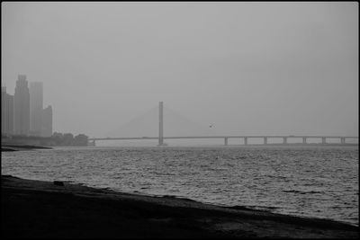 View of suspension bridge over sea