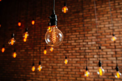 Low angle view of illuminated light bulb