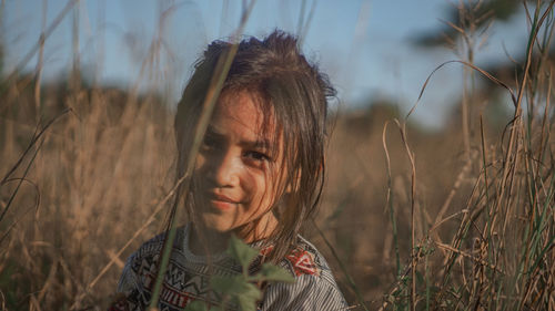 Portrait of smiling young woman on land