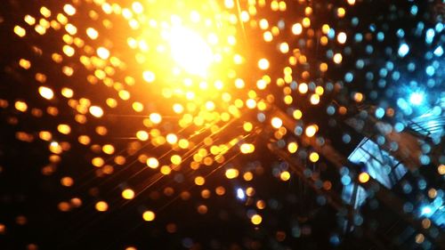 Defocused image of illuminated street lights at night