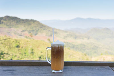 Close-up of coffee on table against sky