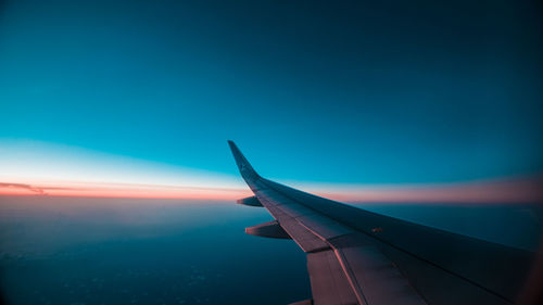 Airplane flying over blue sky