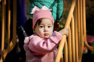 Portrait of cute girl wearing warm clothing