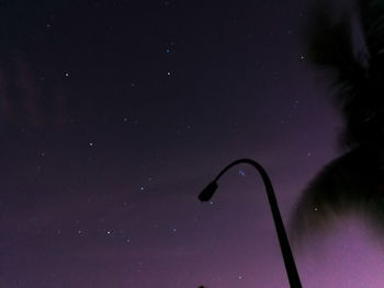 Low angle view of moon against sky at night