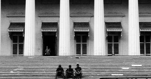 People walking on steps in city