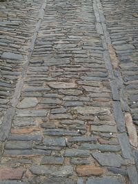 High angle view of stone wall by street