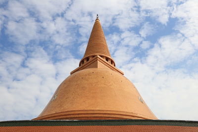 Low angle view of temple building against cloudy sky