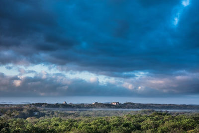 Scenic view of dramatic sky over land