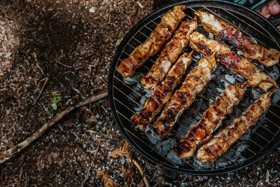 High angle view of meat on barbecue grill