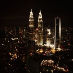 Illuminated buildings in city at night