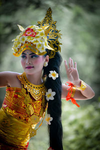 Portrait of young woman wearing traditional clothing