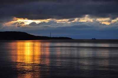 Scenic view of sea against sky at sunset