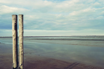 Scenic view of sea against cloudy sky