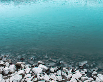 High angle view of rocks in sea