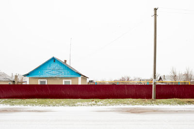 House on field against sky