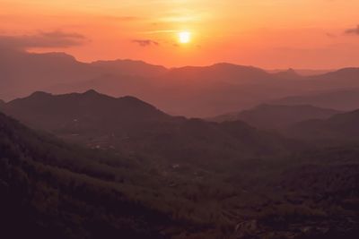 Scenic view of mountains against sky during sunset