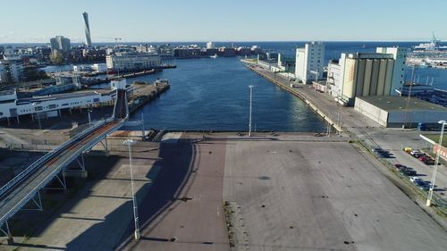 High angle view of road by buildings against sky