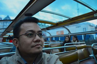 Portrait of man sitting in car