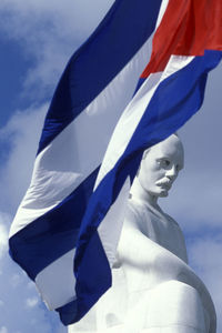 Low angle view of statue against blue sky