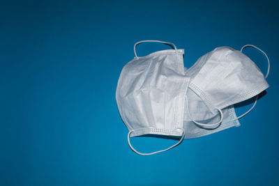 Close-up of mannequin against blue background