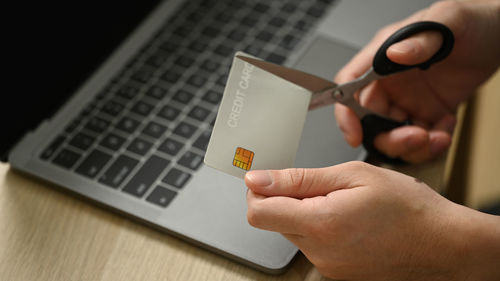 Midsection of woman using laptop