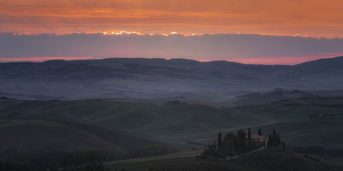 Scenic view of mountains against sky during sunset