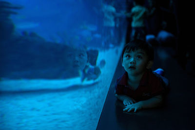 Close-up of boy in aquarium