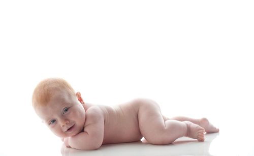 Portrait of cute baby against white background