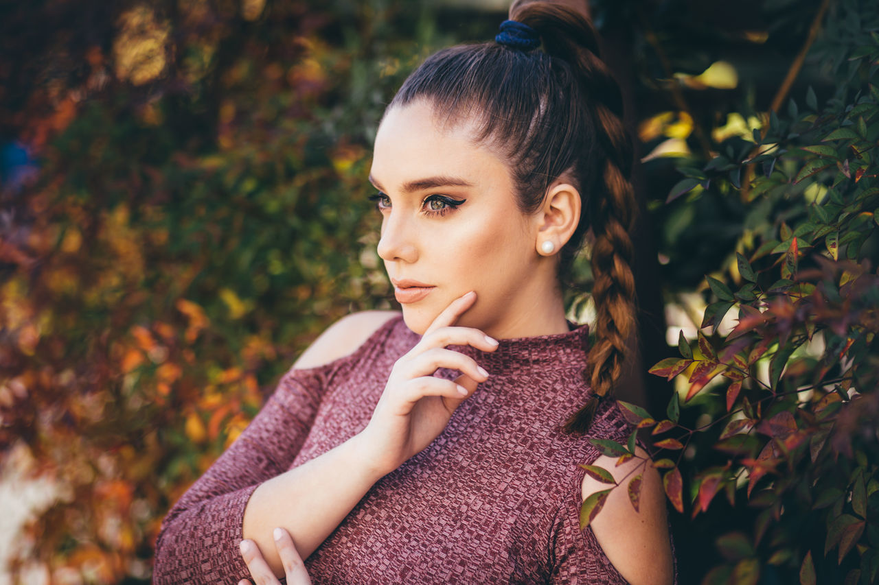 lifestyles, leisure activity, portrait, cute, casual clothing, headshot, focus on foreground, close-up, relaxation, day, outdoors, nature, plant, selective focus, fragility, growth