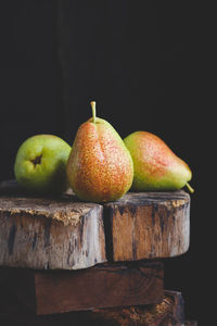 Close-up of apple against black background