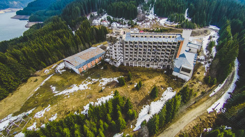 High angle view of trees by building