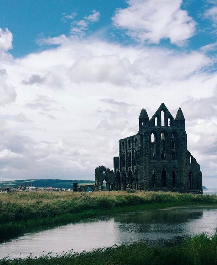 architecture, built structure, cloud - sky, building exterior, history, sky, water, outdoors, day, no people, old ruin, nature, travel destinations, grass