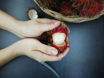 Close-up of hand holding fruits