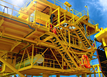 Low angle view of construction site against sky