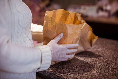 Midsection of woman holding ice cream