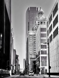 Modern buildings in city against sky